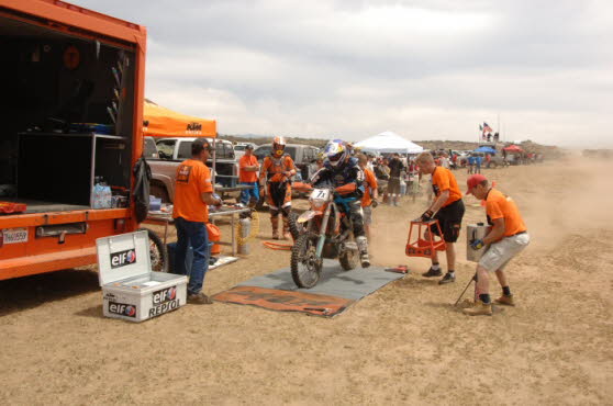 Chris getting on race bike