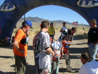 Looking at bike at the finish line